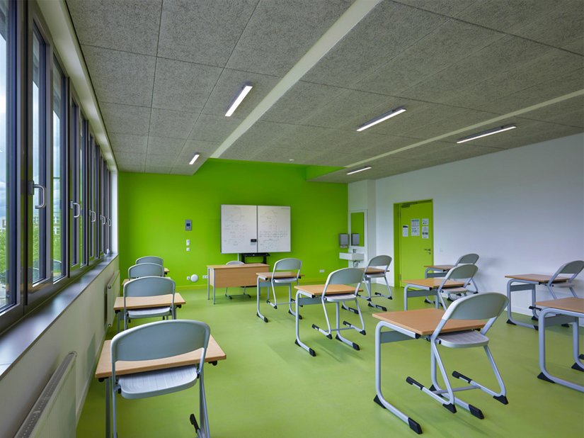 Graduated green tones for the floor and one wall in each room invigorate the classrooms.