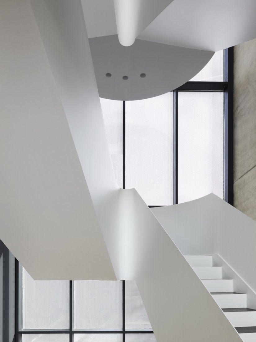 <p>A customized sculpture made from sheet steel fills the stairwell.</p>