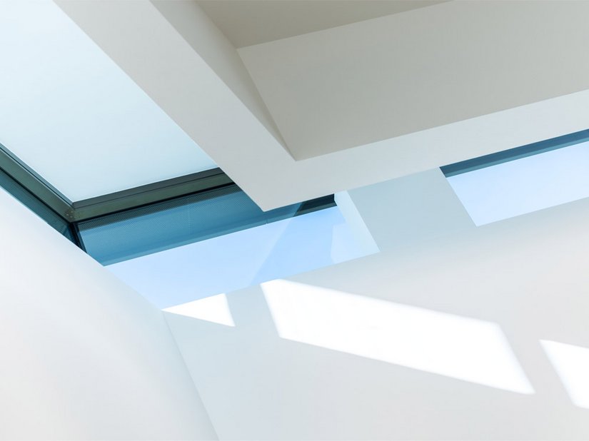 The continuous skylights extend through the entire room.