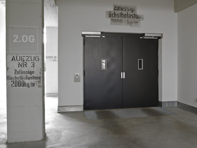 The old logo above the elevator is a reminder of the time before the renovation.