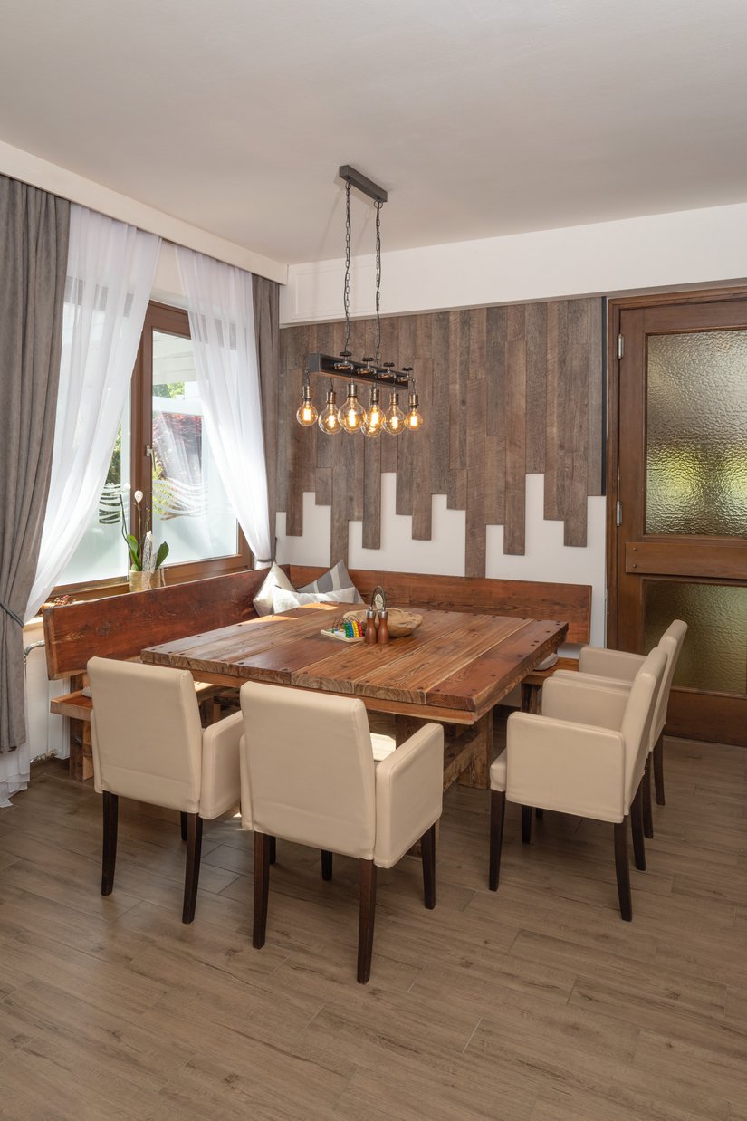 The light color shade of the wall and ceiling design perfectly accentuates the wood used for the interior design.