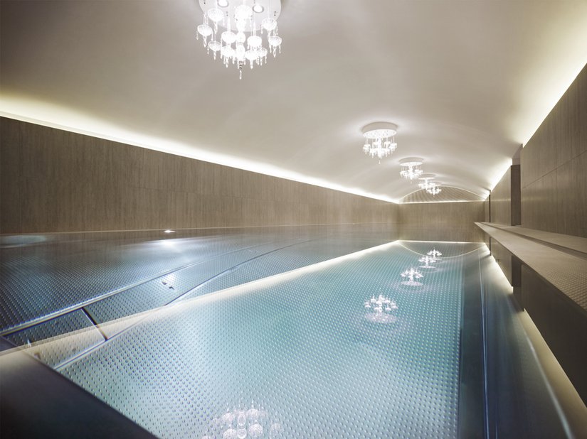 The spa has wood paneling into the pool area.