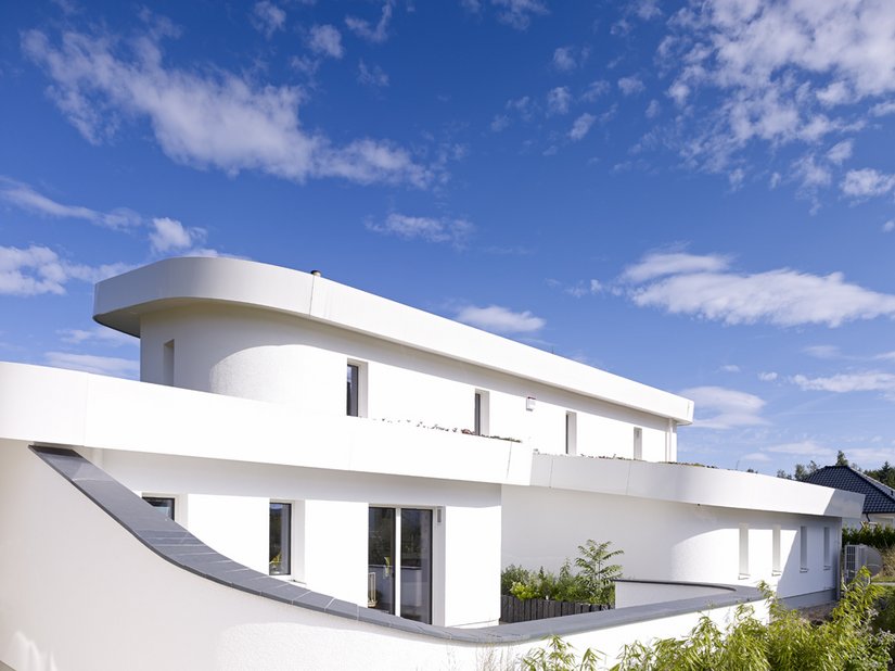 The upper floor of the house acts as a retreat for the parents of the large family.