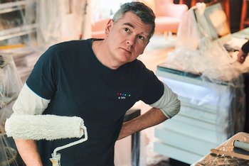 <p>Tradesman Matthias Ihrke casts a careful eye over the ceiling, where his young colleague is at work.</p>