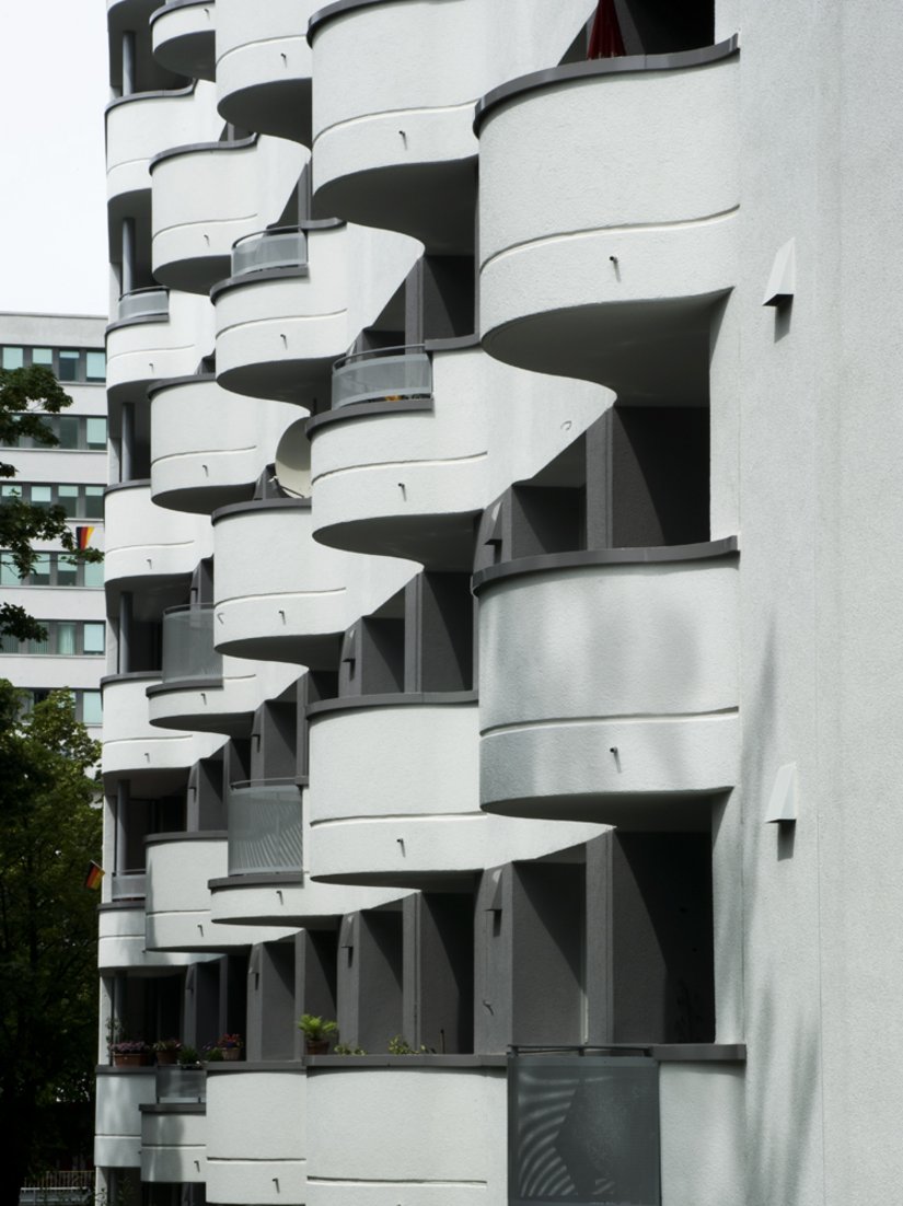 Some parapets were paneled with perforated plates, the other balcony version was completely reinforced and rendered.