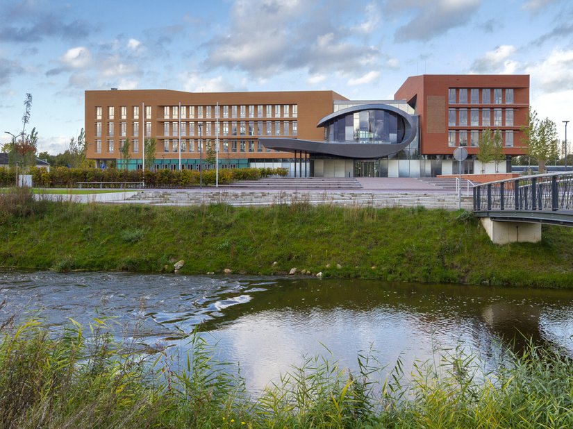 The new town hall stands on the banks of the river Berkel.