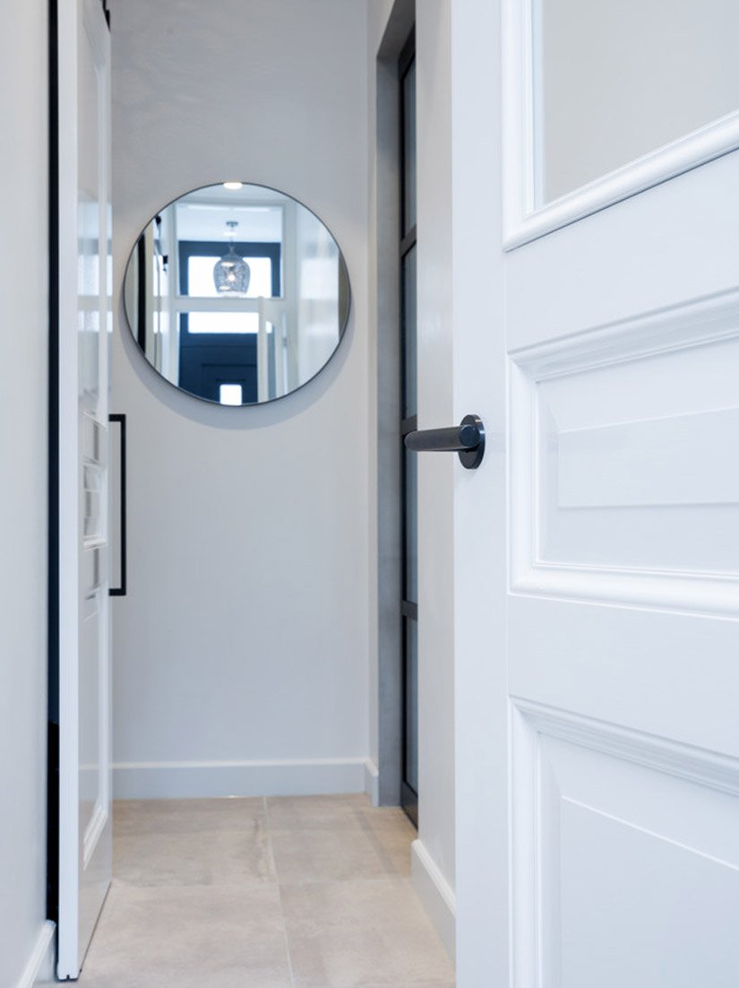 The flooring, and the light design of the walls, makes the entry area seem light and inviting.