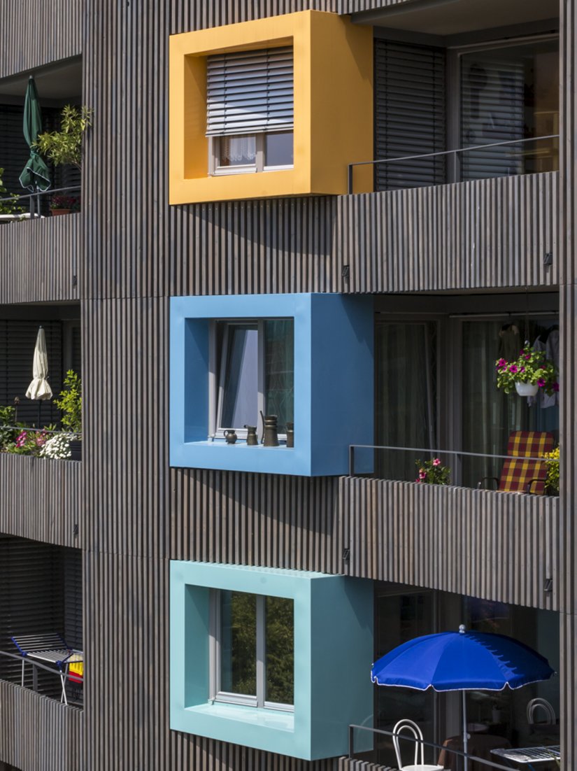 The window boxes are decorated in three different colors.